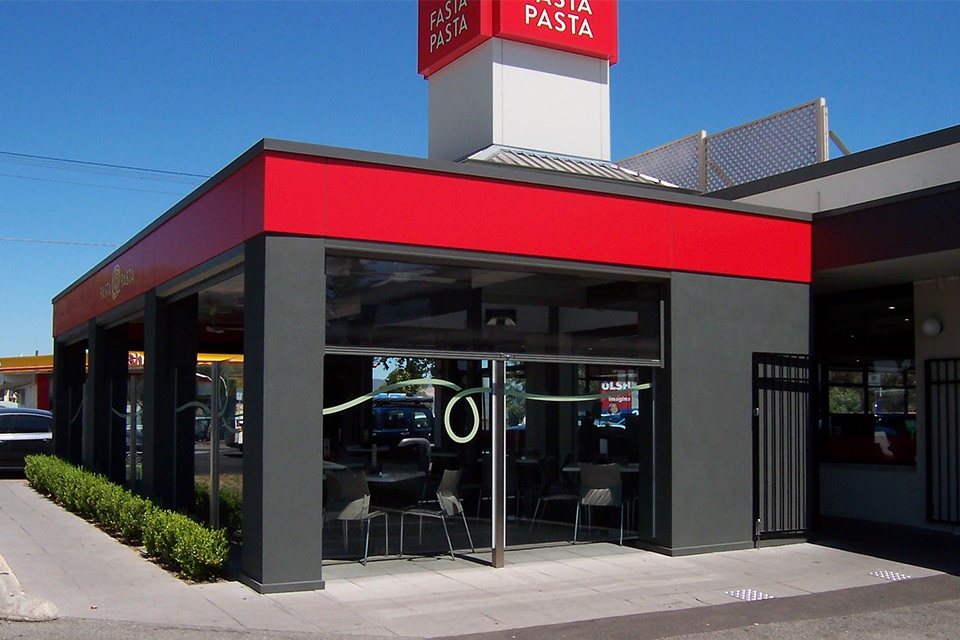 Clear PVC cafe blinds enclosing a restaurant's outdoor dining area