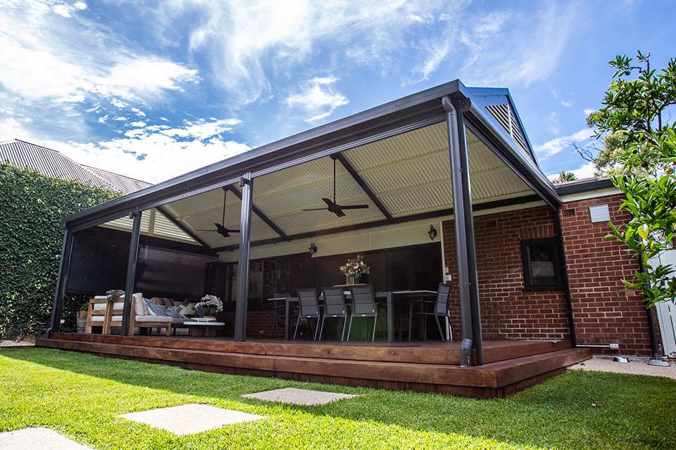 Charcoal Colorbond gable verandah with ceiling fans over a timber deck