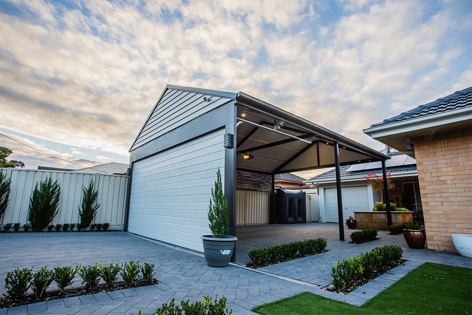 Custom gable-roof carport over a paved driveway