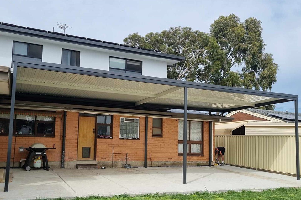 Flat verandah with a charcoal frame on a two-storey home