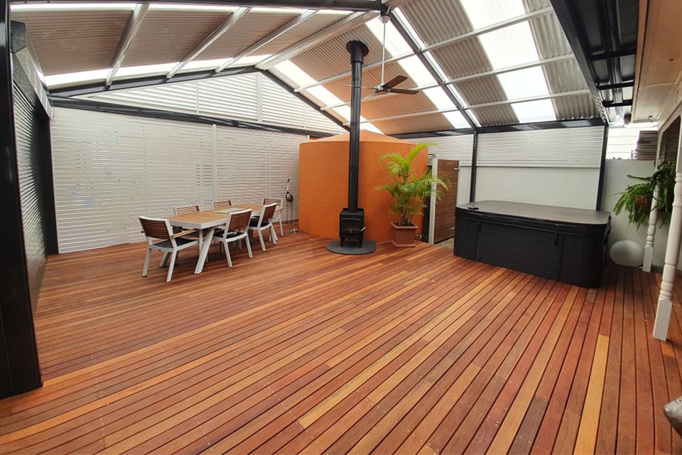 Hardwood timber deck under a gable verandah with roof lights