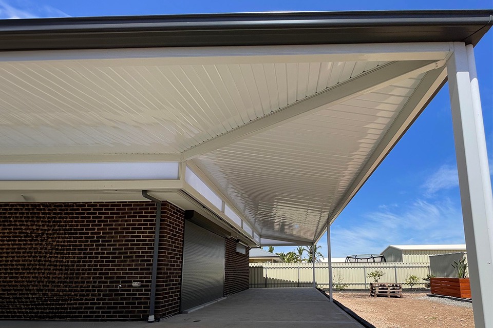 Skillion verandah with a cream Colorbond ceiling on a brick home